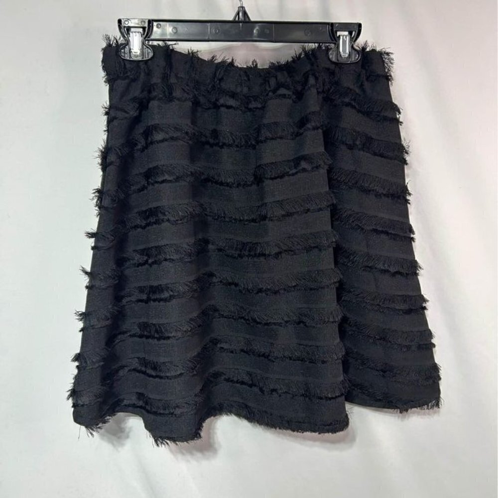 Woman’s black fringe skirt with pockets. Size 10.